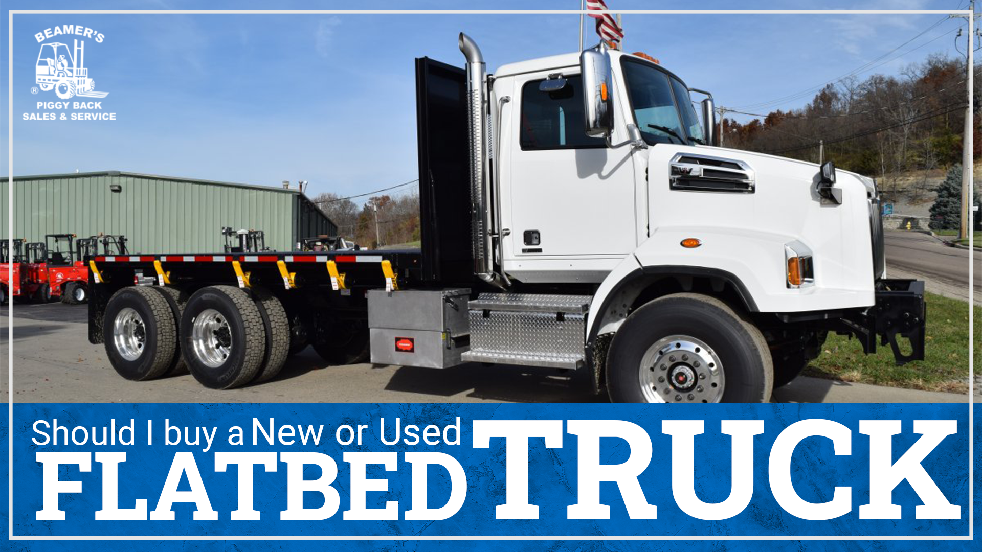 A white flatbed truck with the words "should I buy a new or used flatbed truck" underneath